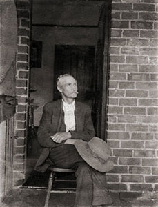 Grandpa in Doorway restored ⓒ Cate McRae 2009; All Rights Reserved